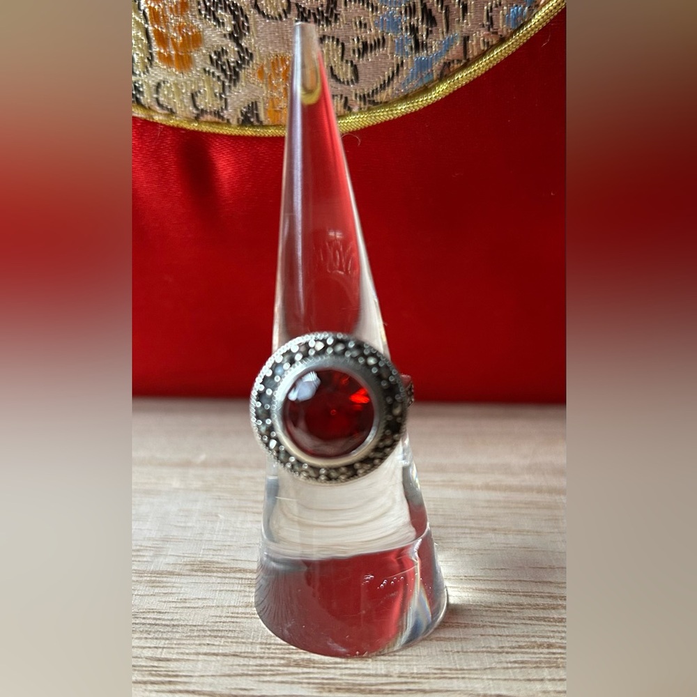Sterling and Marcasite Ring with brilliant red glass stone. 6